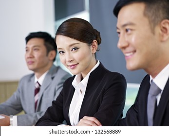 Asian Business People At A Meeting.