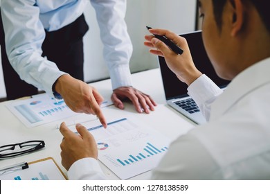 Asian business people meeting new startup project pointing graph discussion and analysis data charts and graphs.Business finances and accounting concept - Shutterstock ID 1278138589
