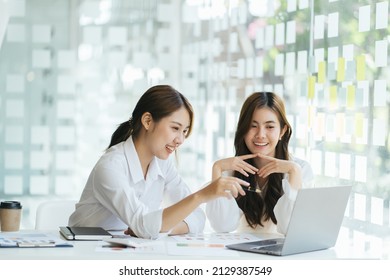 Asian Business People Meeting With New Startup Project Pointing Graph Discussion And Analysis Data Charts And Graphs.Business Finances And Accounting Concept.