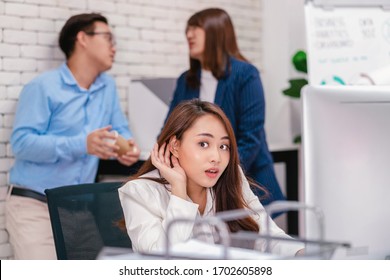 Asian Business Woman Be Curious And Listening The Couple Talking About Lovers Problem While Working Hour At Modern Office, Gossip And Secret, Eavesdrop And Whisper, Relationship In Office Concept