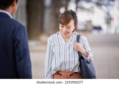 Asian business woman bowing and greeting