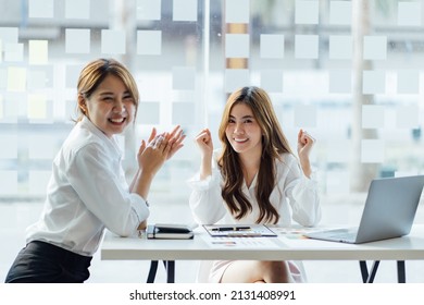 Asian Business Woman Celebrating Victory, Won Profitable Contract, Unexpected Amazing Win, Big Deal On Stock, Impressive Achievement, Unbelievable Success, Funny Positive Emotions At Office.