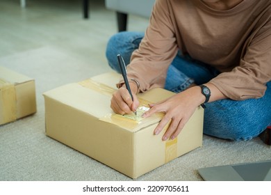 Asian Business Woman Checking Customer Order Online Shipping Boxes At Home,Starting SME Small Business Entrepreneur Freelance. Online Business.