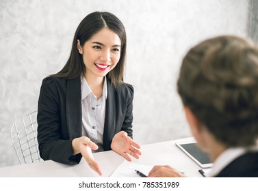 Asian Business Woman Discussing/job Interview With Colleauge/boss For Business Meeting