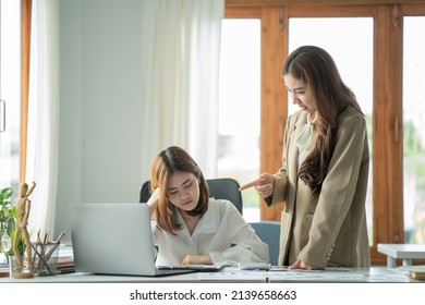 Asian business woman employee stressed at office place , angry boss blaming her - Business concept - Shutterstock ID 2139658663
