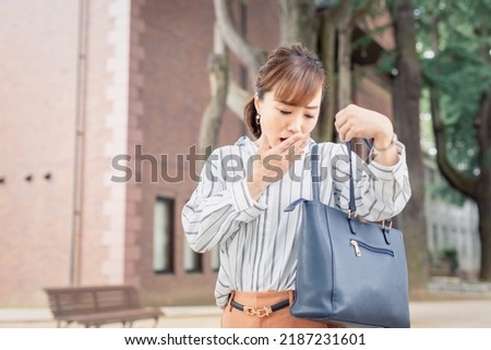 Asian business woman forgetting something