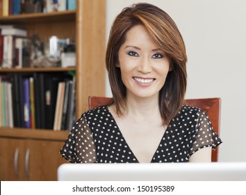 Asian Business Woman In Her Office