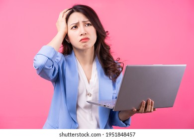 Asian Business Woman Holding Laptop On Pink Background