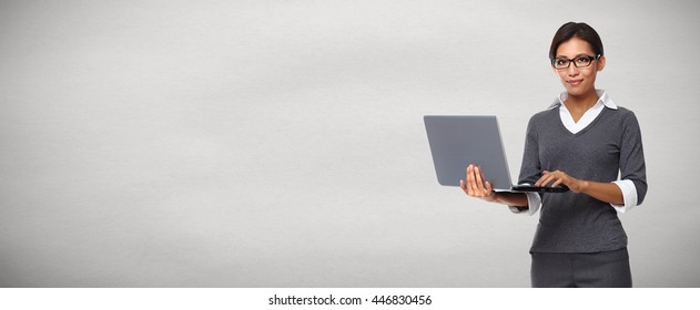 Asian business woman with laptop.