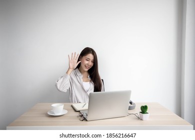 Asian Business Woman Is Making A Video Call For A Conference Call. The Concept Of Video Conferencing Technology And Working From Home.