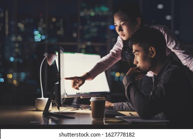 Asian Business Woman And Business Man Working Hard Late Together With Technology Computer In Office, Customer Service And Call Center, Team Work With Colleagues For Success Achievement Project Concept