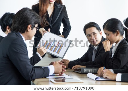 Asian Business Woman pointing her female employee and blame in meeting. young lady employee face show sad expression looking down the desk.