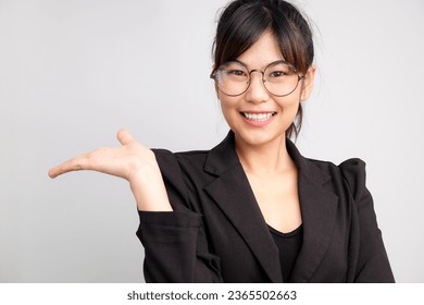 Asian business woman show welcome empty hand on white background copyspace ad use - Shutterstock ID 2365502663