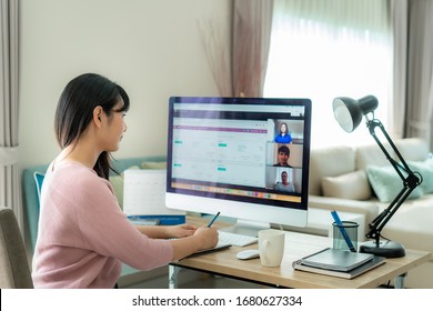 Asian business woman talking to her colleagues about plan in video conference. Multiethnic business team using computer for a online meeting in video call. Group of people smart working from home.
 - Shutterstock ID 1680627334