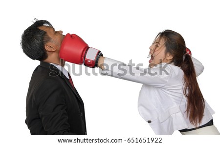 Asian business woman is wearing a boxing glove punch business man isolate on white background.