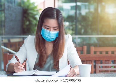 Asian Business Woman Wearing Mask  And Working Outside. Business, New Normal And Healthy Concept.