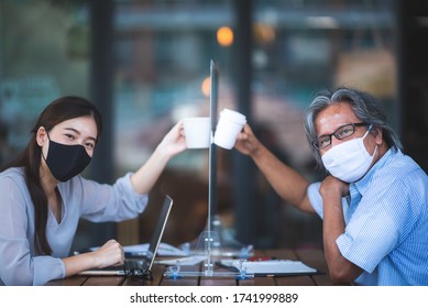 Asian Business Woman Working In Cafe With Medical Face Mask And Table Shield, Social Distancing Of The New Normal Lifestyle After Epidemic Of Coronavirus COVID-19