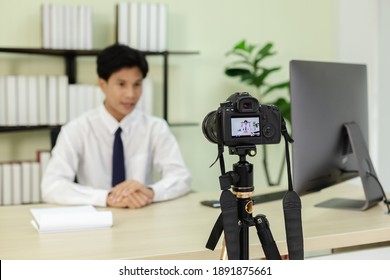 Asian Businessman Blogger Talking Video Camera. Online Creating Video Tutorials.