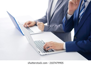 Asian Businessman And Businesswoman Working At A Office, No Face