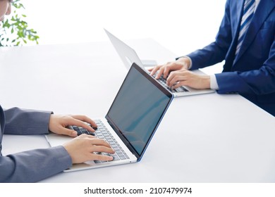 Asian Businessman And Businesswoman Working At A Office, No Face