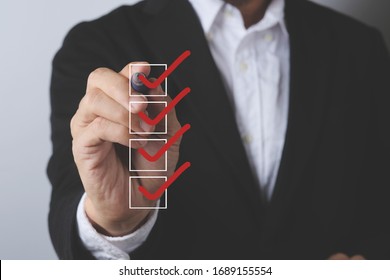 Asian businessman checklist and writer at work table,business concept - Shutterstock ID 1689155554