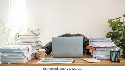 Asian Businessman Online Working At Home With A Lot Of Document At Home. Busy And Exhausted.