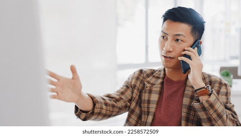 Asian businessman, phone call and desk with communication, negotiation and deal for marketing company. Man, smartphone and consulting for collaboration opportunity, contact and innovation in Tokyo - Shutterstock ID 2258572509