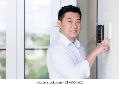 Asian Businessman Portrait, Man Walks Into Modern Office, Uses Doorbell With Fingerprint Lock, Man Looks At Camera And Smiles