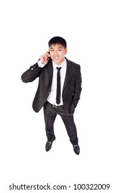 Asian Businessman Talking Mobile Cell Phone, Happy Smile Looking Up, Using Cellphone, Top View Full Length Portrait Of Young Business Man Phone Call, Wear Elegant Suit Isolated Over White Background