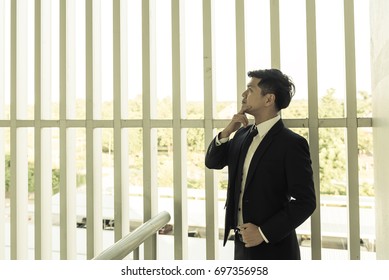 Asian businessman think about work,It is hard work,No have ideas for products,thailand people - Shutterstock ID 697356958