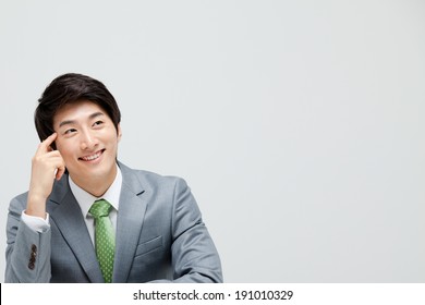 Asian Businessman Thinking 