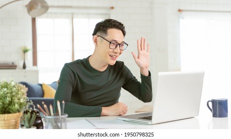 Asian Businessman Using Computer Laptop Talking For Video Call Conference Meeting. Work From Home Concept.