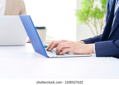 Asian Businessman Using A Laptop, No Face