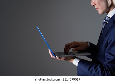 Asian Businessman Using The Laptop, No Face