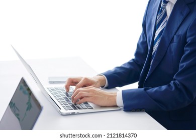 Asian Businessman Using The Laptop At The Office, No Face