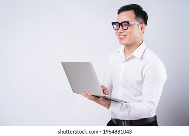 Asian Businessman Using Laptop On White Background