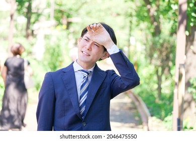 Asian Businessman Walking Outdoor In The Summer