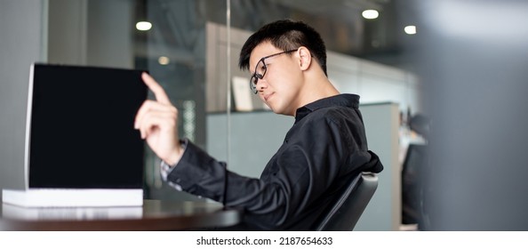 Asian Businessman Wearing Glasses Reading Book In Public Library. Education Research And Self Improvement With Printed Media. World Book Day Concept