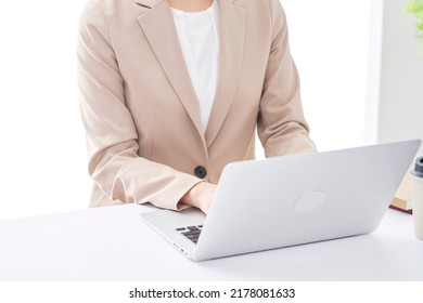 Asian businessman working with the laptop at the office, no face