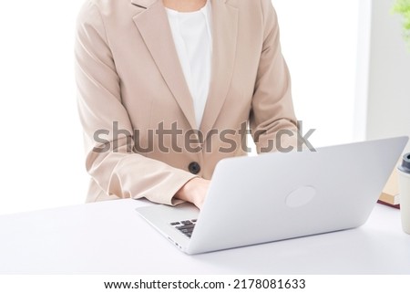 Asian businessman working with the laptop at the office, no face