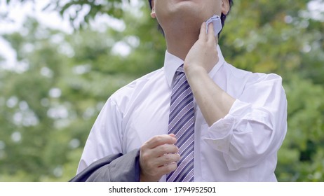 Asian Businessman Working Outside In Summer