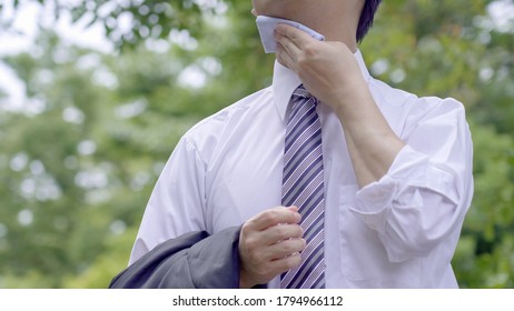 Asian Businessman Working Outside In Summer