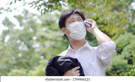 Asian Businessman Working Outside In Summer