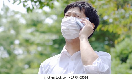 Asian Businessman Working Outside In Summer