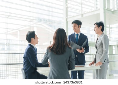 asian businesspeople having meeting in office - Powered by Shutterstock