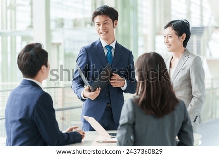 asian businesspeople having meeting in office