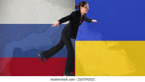 Asian businesswoman balancing on one feet against russia and ukraine flag design background. ukraine crisis, invasion and international relations concept - Powered by Shutterstock