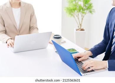 Asian Businesswoman And Businessman Working At Office, No Face