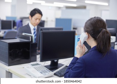 Asian businesswoman calling at the office