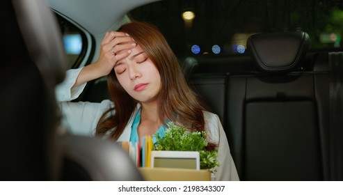 Asian Businesswoman Get Off Work And Fired From Job Sitting In Taxi At Night